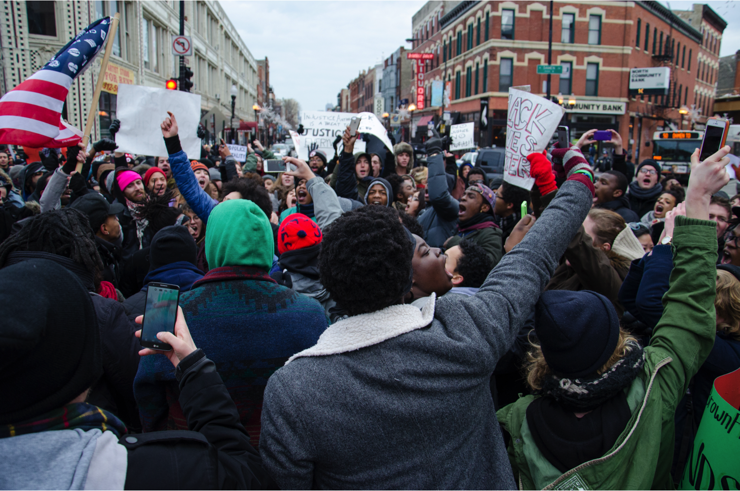 Protesters block the traffic at Damen and Milwaukee Avenues, chanting “we did this for Mike Brown,” “the racist cops, we don’t need them” and “black lives matter.” The organizer Kristiana Colón estimated that about 500 people were participating at the peak of the demonstration. (Jin Wu/Medill)