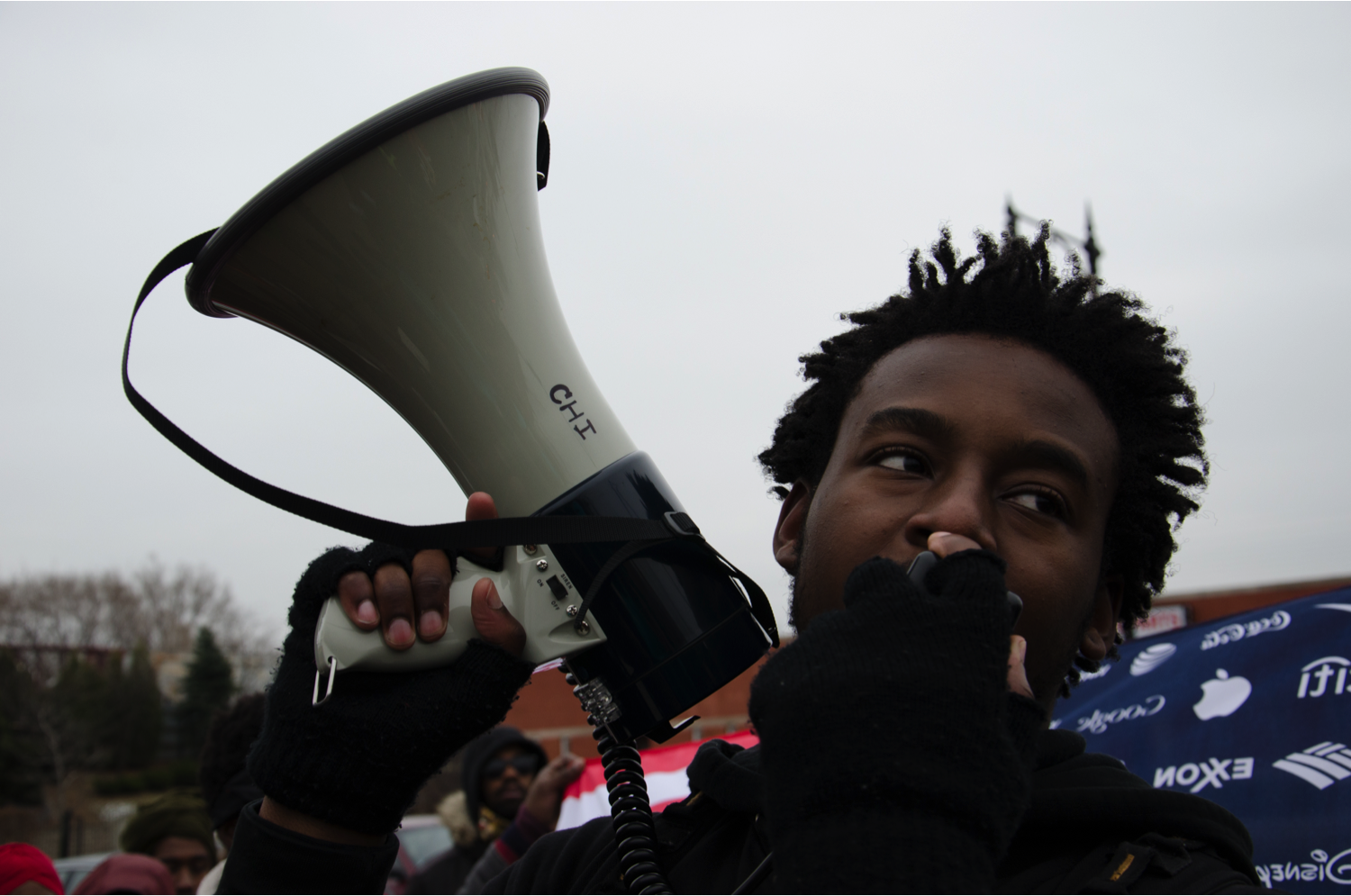 Malcolm London, of Black Youth Project 100, encourages protesters to keep fighting for the freedom of black community in front of Wal-Mart in West Side. “It’s out duty to fight,” he said. “It’s our duty to win.” (Jin Wu/Medill)