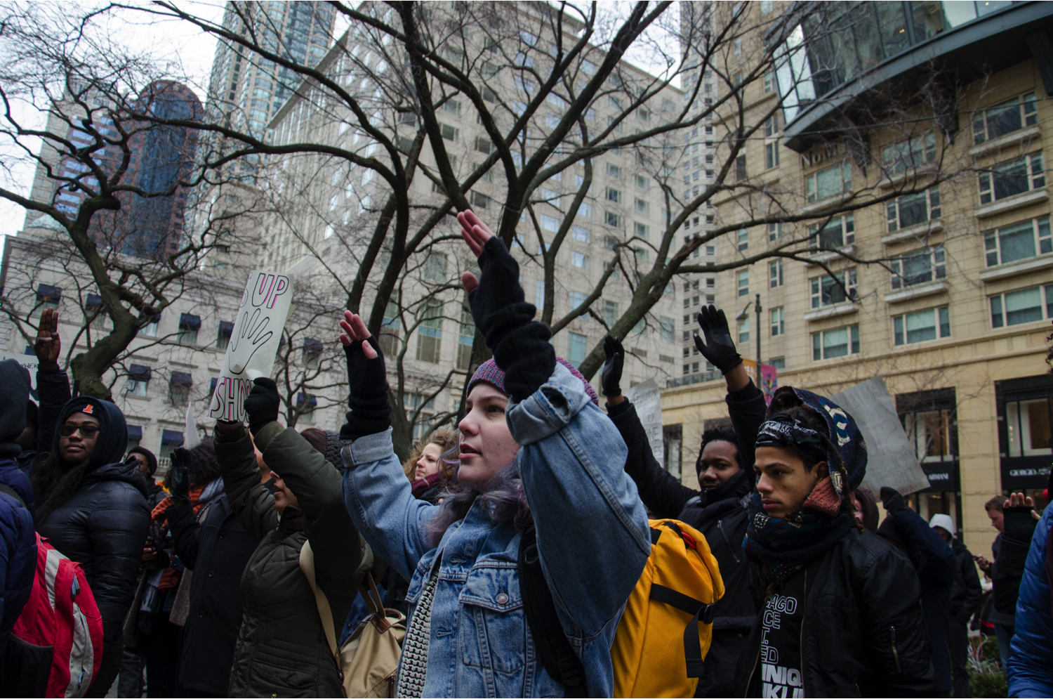 Protesters raise their hands to express one of the core ideas of this demonstration: “Hands up. Don’t shop.” They said keeping wallets shut is a show of solidarity for Michael Brown. (Jin Wu/Medill)