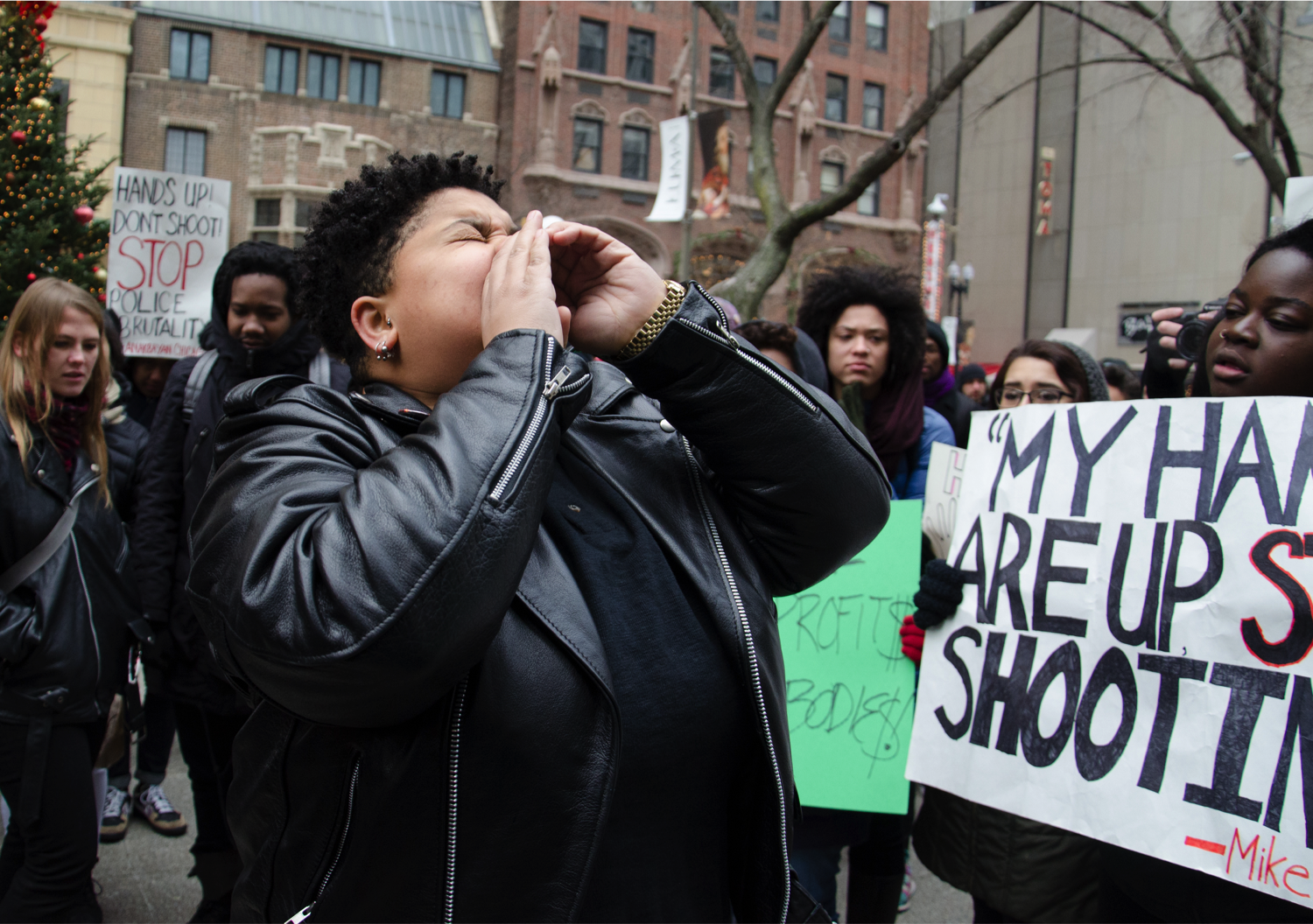 Protester Angie Brilliance, of Black Youth Project 100, chants “no justice, no peace, no racist police.” (Jin Wu/Medill)