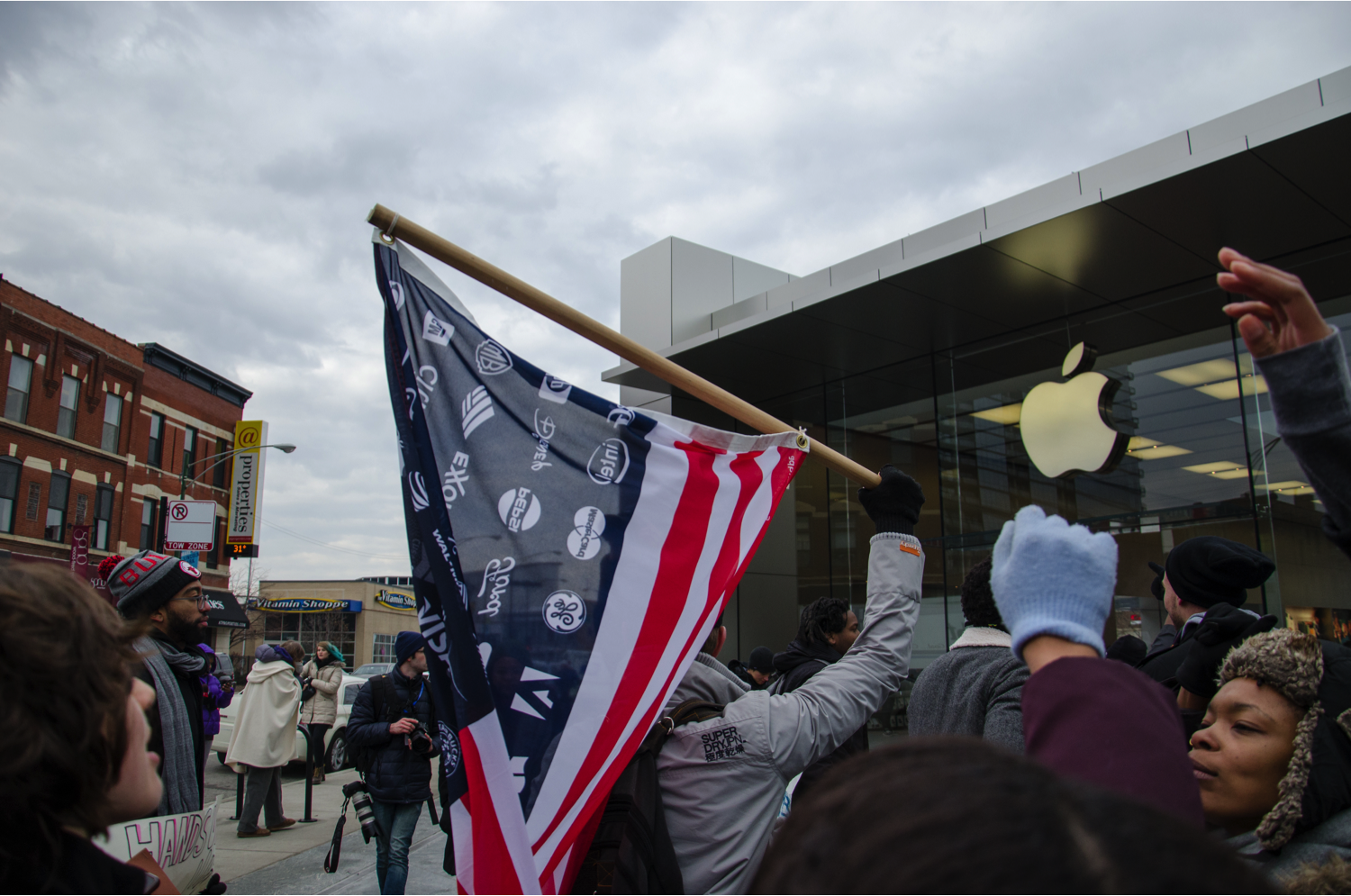 Protesters chant “if we don’t get the justice, they don’t get the profit” in front of the Apple Store at North and Clybourn. “If the police force, not just in Ferguson but in Chicago and across the country, is more concerned about protecting window glass than protecting the body of a black boy,” Kristiana Colón said. “Then that is a system that I don't want to give a single dime to.” (Jin Wu/Medill)